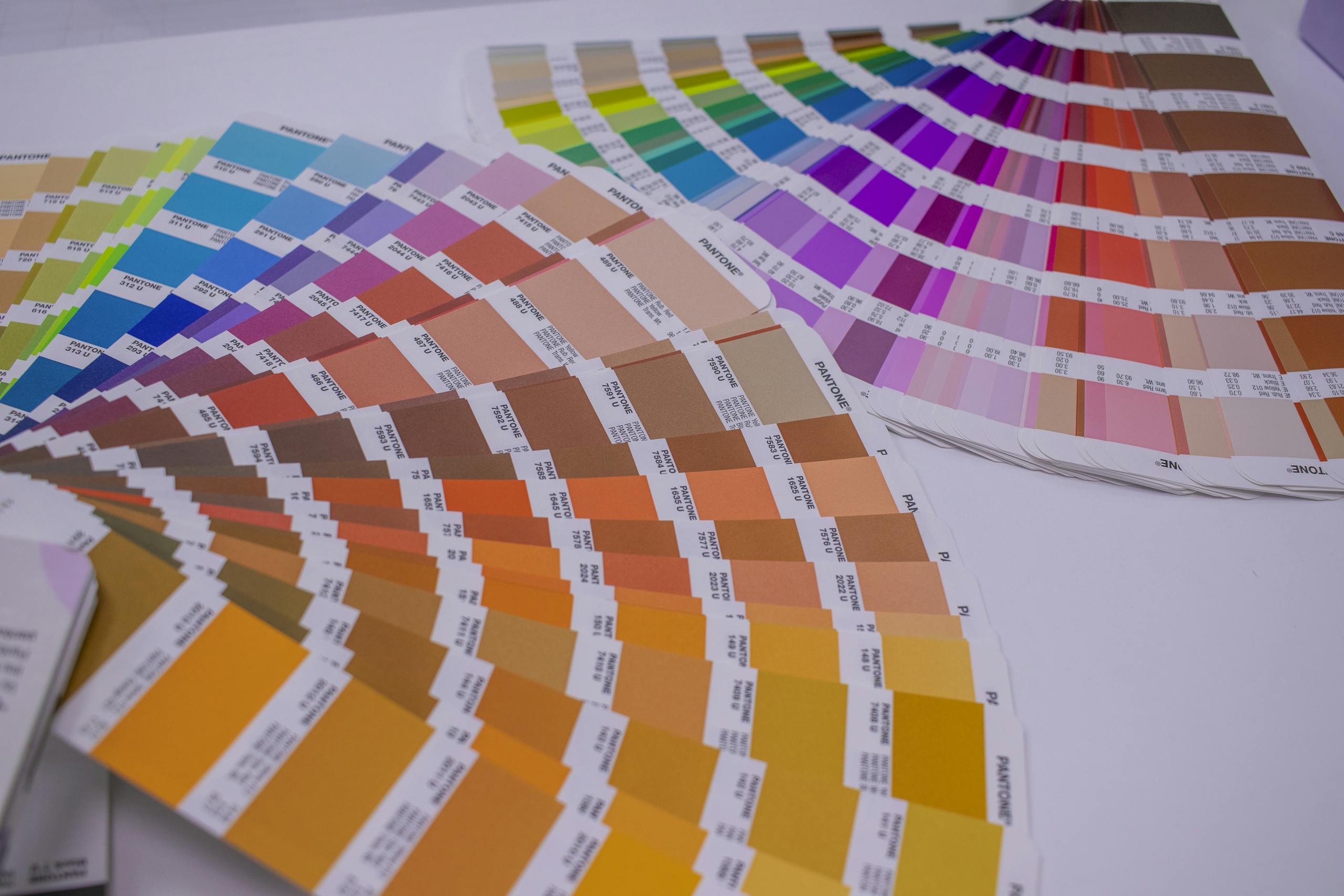 A collection of Pantone color swatches showcasing a wide range of vivid hues for designers.